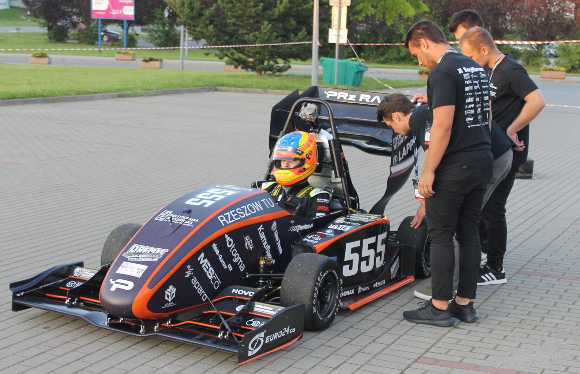 Team of the Rzészow University of Technology (Poland), reviewing their hybrid vehicle.